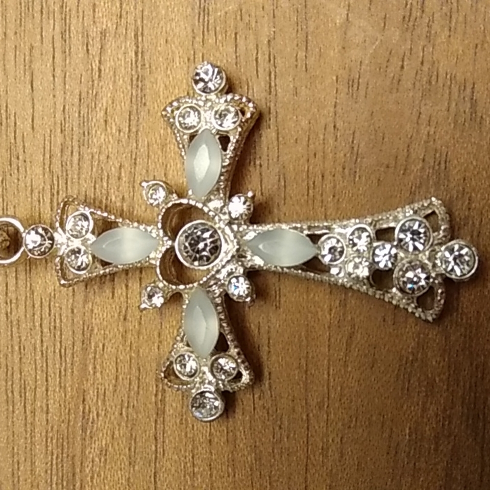 Decorative cross on a silver chain